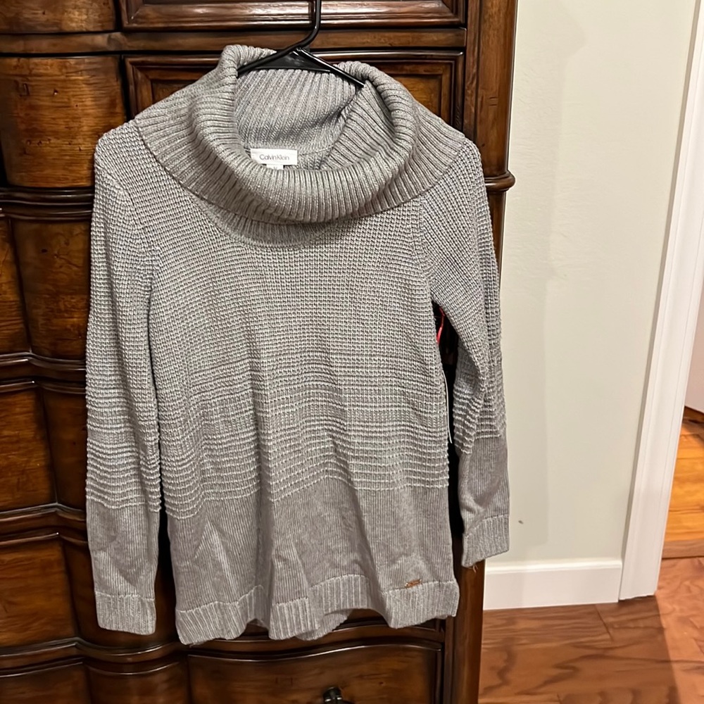 Brand new with tags.  Calvin Klein sweater